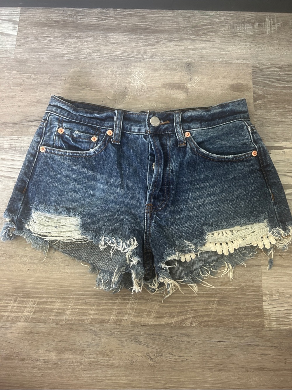 We the Free Blue Distressed Denim Cutoff Shorts with Lace detail